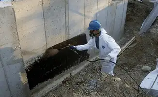 Professional waterproofing the exterior walls of the basement in Columbia, MO