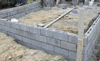 Professionals building a foundation with blocks in Columbia, MO