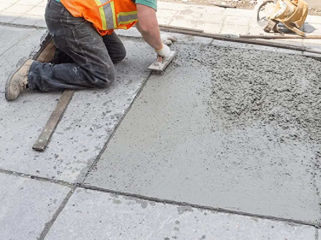 Professional repairing a concrete floor in Columbia, MO